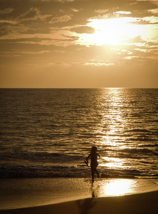 hawaii beaches girls. Young Girl Playing on Beach at