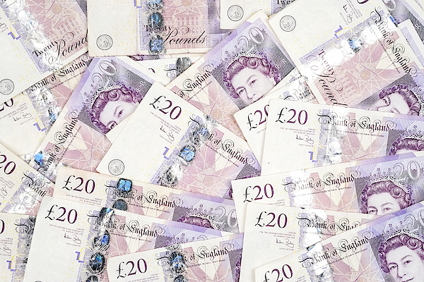 UK twenty pound notes - background Photograph by Clubfoto