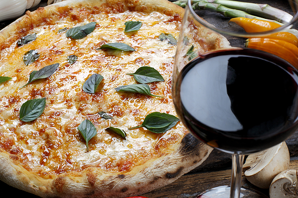 Pizza with glass of red wine Photograph by Ribeirorocha