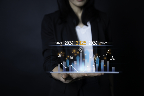 Business Professional Analyzes Future Growth Trends Using Data Visualization Tools Teera Konakan