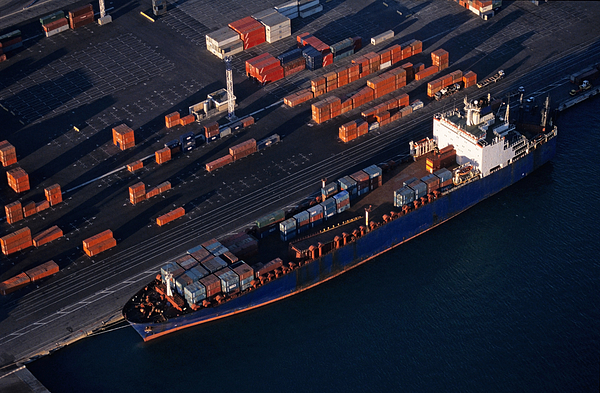 Cargo at quay loading freight container at port, aerial view Photograph by Sami Sarkis