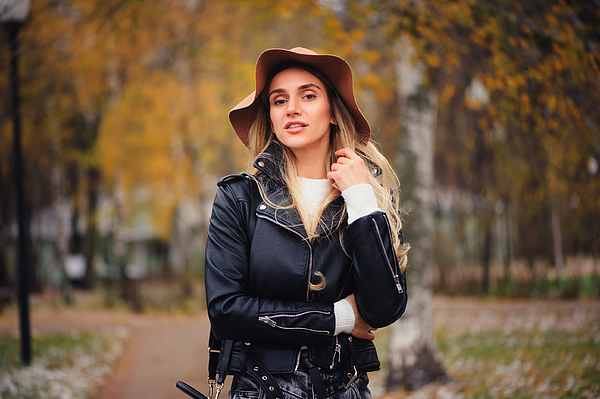 Fashion Autumn Portrait Of Young Happy Woman Walking Outdoor In Fall Park In Hat And Leather Jacket Photograph by Mkovalevskaya