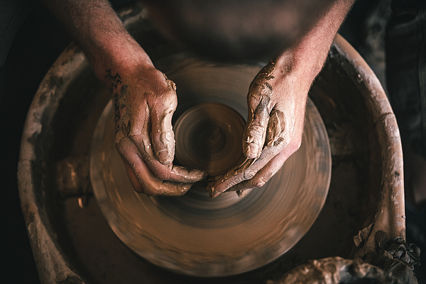 Hands of master in process of work in pottery / ceramic workshop. Small business concept. Photograph by Olga Pankova Hands of master in process of work in pottery / ceramic workshop. Small business concept. Photograph by Olga Pankova