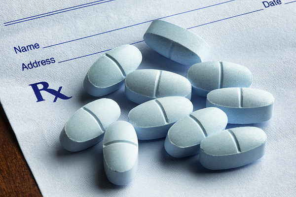 Hydrocodone with Acetaminophen Tablets on a Prescription Form Photograph by Smartstock