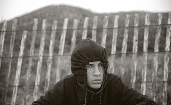 Moody Teenager In Hoodie Photograph by Melnotte