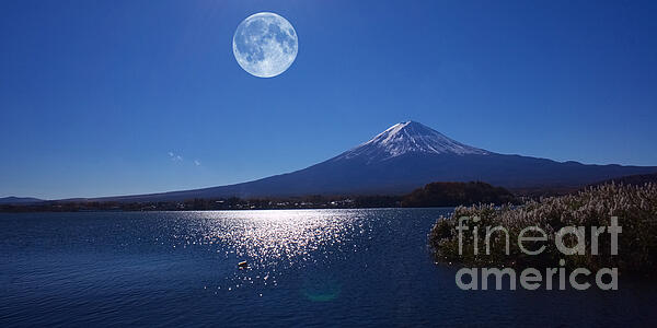 Moonlight illuminates a serene lake with a majestic mountain backdrop in Yamanashi