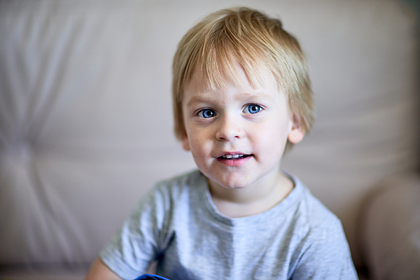 Portrait of a small blond boy 2-3 years old at home watching TV Photograph by Ekaterina Goncharova