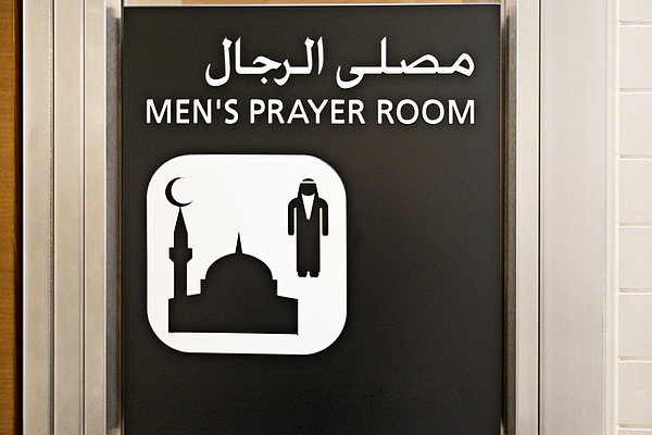Prayer room sign at Doha airport Photograph by Reza Estakhrian