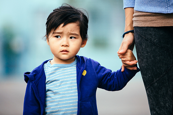 Toddler girl with a serious looking face Photograph by images by Tang Ming Tung
