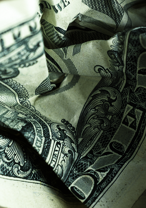 US currency: crumpled one dollar bill, close-up Photograph by Microzoa