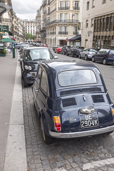 Vintage Fiat 500 car parked in Rue Marbeuf near Avenue des Champs-Elysees in Paris in spring Photograph by Silkfactory