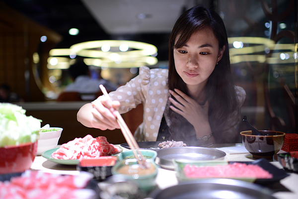 Woman Eating Hot Pot - XXXLarge Photograph by PhotoTalk
