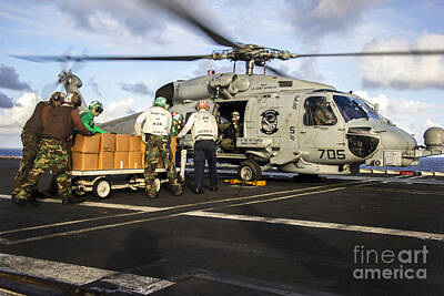 Politicians Photos - Sailors Load Relief Supplies Onto An by Stocktrek Images