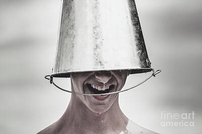 Athletes Rights Managed Images - Smiling man laughing with ice bucket on head Royalty-Free Image by Jorgo Photography