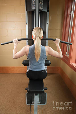 Athletes Photos - Woman working out in the gym. by Don Landwehrle