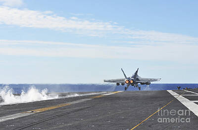 Politicians Photos - An Fa-18e Super Hornet Launches by Stocktrek Images
