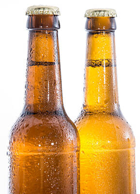 Beer Rights Managed Images - Two wet bottles of Beer on white Royalty-Free Image by Handmade Pictures