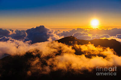 Mountain Rights Managed Images - Clouds at sunrise over Haleakala Crater Maui Hawaii USA Royalty-Free Image by Don Landwehrle