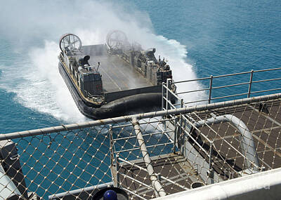 Beach Royalty Free Images - A Landing Craft Air Cushion Approaches Royalty-Free Image by Stocktrek Images