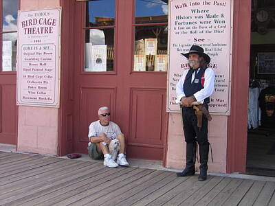 Pineapple - A Dog And A Re-enactor Rest In The Front Of The Bird Cage Theater Tombstone Arizona 2004 by David Lee Guss