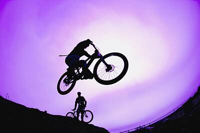 Sports Photos - A Stunt Cyclist Silhouette by Corey Hochachka