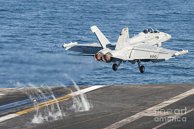 Transportation Photos - An Ea-18g Growler Launches by Stocktrek Images