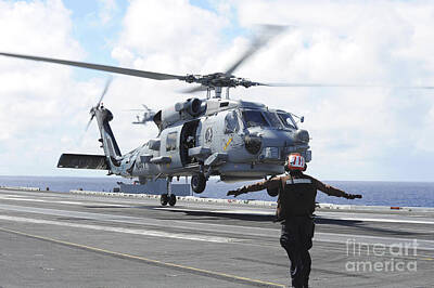 Politicians Photos - An Mh-60r Sea Hawk Lifts Off The Flight by Stocktrek Images