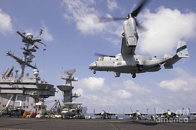 Transportation Photos - An Mv-22 Osprey Lands Aboard Uss Harry by Stocktrek Images