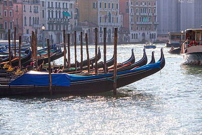 Achieving - Anchored gondolas in Venice by Patricia Hofmeester