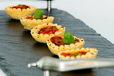 Kitchen Mark Rogan Rights Managed Images - Cherry tomato tartlets Royalty-Free Image by Ash Sharesomephotos