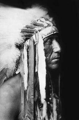 Portraits Photos - Crow Indian man circa 1905 by Aged Pixel