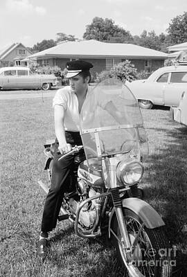 Musician Photo Rights Managed Images - Elvis Presley with his 1956 Harley KH and his Cadillacs Royalty-Free Image by The Harrington Collection