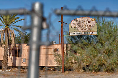 Needle And Thread - Fenced in  abandoned 1950s motel trailer by Scott Campbell