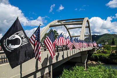 Cargo Boats Rights Managed Images - Flags on the Rogue River Bridge Royalty-Free Image by Mick Anderson