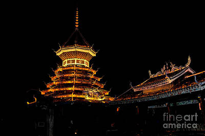 Spiral Staircases - Illuminated Pagoda at night  by Dan Yeger