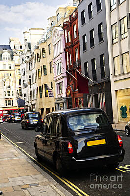 Transportation Royalty-Free and Rights-Managed Images - London taxi on shopping street by Elena Elisseeva