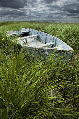 Randall Nyhof Royalty-Free and Rights-Managed Images - Old Weathered Row Boat abandoned in the Grass on PEI by Randall Nyhof