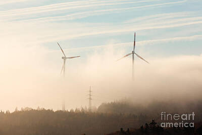 Light Abstractions Royalty Free Images - Wind turbines in fog Royalty-Free Image by Stephan Pietzko