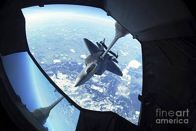 Needle And Thread - A F-22 Raptor Refuels Behind A Kc-10 by Stocktrek Images