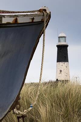 Female Outdoors - Abandoned Boat And Lighthouse by John Short
