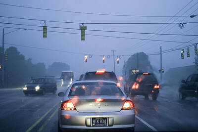 Poolside Paradise - Cars and Traffic Lights in a Rain Storm by Randall Nyhof