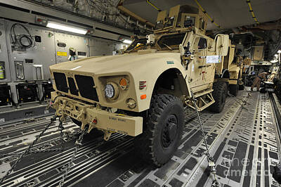 Dog Illustrations - Two M-atvs Await Transport On A C-17 by Stocktrek Images