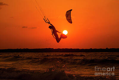 Comedian Drawings Royalty Free Images - Kite surfing at sunset Royalty-Free Image by Tomi Junger