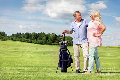 Sports Photos - Senior couple enjoying golf game. by Michal Bednarek