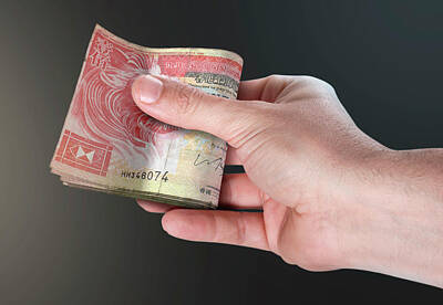 Cities Digital Art Royalty Free Images - Hand Passing Wad Of Cash Royalty-Free Image by Allan Swart