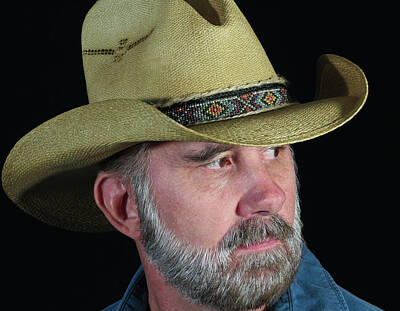 Modern Man Yachts - A Man with a Gray Beard in a Straw Cowboy Hat by Derrick Neill