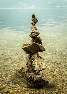 Abstract Airplane Art Rights Managed Images - A stone piles on the shore of lake Traunsee Royalty-Free Image by Stefan Rotter