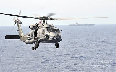 Politicians Royalty-Free and Rights-Managed Images - An Mh-60r Seahawk Helicopter In Flight by Stocktrek Images