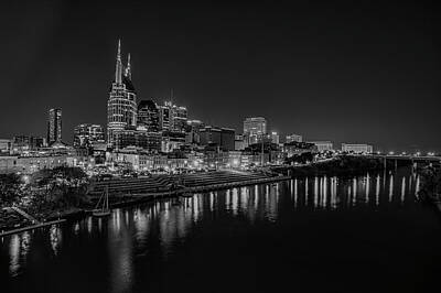 Modern Man Air Travel - BW night time in downtown Nashville TN by Jim Pearson