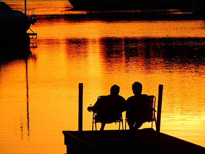 Rusty Trucks - Couple watching sunset on the lake by Michelle Stern